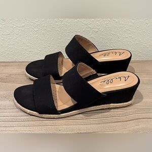 Black fabric slip-on sandals, size 7